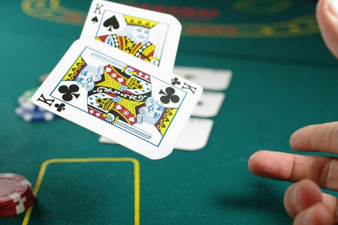 Poker hands and chips on the felt at a Brightwildlife evening
